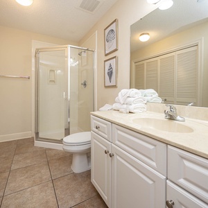 Refresh in this additional guest bath with a walk-in shower and laundry area with a washer and dryer in your rental