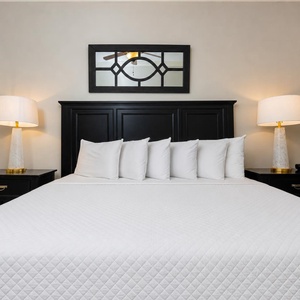 Sink into the soft bedding of your king guest suite, where restful nights await after a fun-filled day at the coast