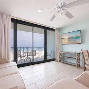 Relax in the inviting living area featuring a comfortable sofa with queen sleeper, with stunning views from the balcony
