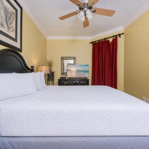 Unwind after a day at the beach in this queen guest suite and watch a movie