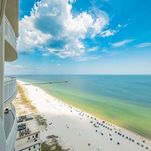 Stunning views from the balcony, where you can relax and take in the vibrant beach scene below