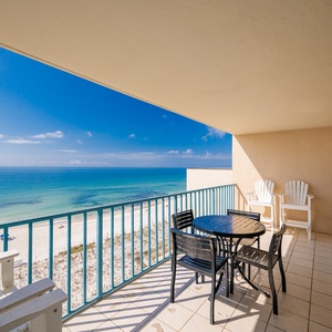Gentle coastal breezes brush your skin as you relax on your balcony watching waves roll softly along the shore