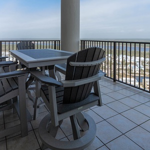 This balcony features comfortable seating and a stunning view of the state park from the twenty-second floor