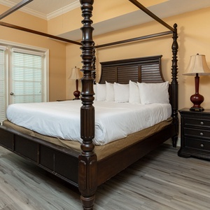 Relax in the cozy four-poster king bed in the master suite, enjoying peaceful moments before the day begins