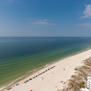 Breathe gulf air while walking the shore, watching neat rows of umbrellas and listening to gentle waves