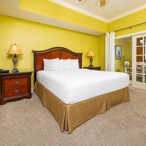 This king master suite invites restful nights surrounded by plush bedding and soft carpet underfoot