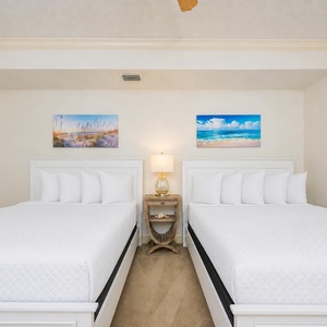 Relax on one of the cozy queen beds in this guest suite and enjoy a peaceful slumber
