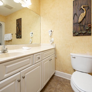 Indulge in refreshing moments in this guest bath, perfectly designed for routines before a day at the coast