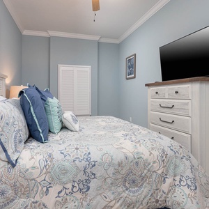 Relax and recharge in the king master suite, with soft bedding inviting a restful night's sleep