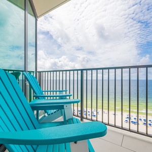 Relax in the vibrant chairs on your balcony, savoring the expansive views of the beach and gentle waves