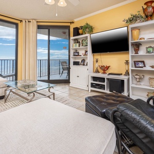 Relax on the comfortable seating while enjoying the view through large windows that invite natural light into the space