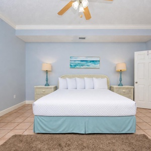 Sink into plush king bedding in this guest suite with a calming atmosphere and coastal decor