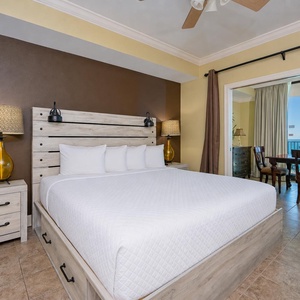 Rest in the king master suite where quiet lamps flicker as you gaze toward the coast from the balcony