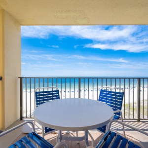 The balcony overlooks the beach front, offering a serene spot to enjoy the coastal view and fresh air