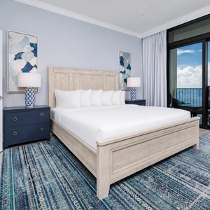 Serene master bedroom featuring a king bed, stylish decor, and access to breathtaking views from the balcony