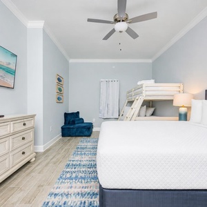 Tranquil guest room, perfect for unwinding after a beach day with a queen bed and a twin over full bunk