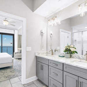 Experience relaxation in the master suite featuring dual sinks, elegant fixtures, relaxing tub, and a large shower