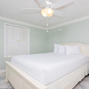 Serene atmosphere for restful nights in this guest bedroom with a queen bed, the perfect conclusion to a beach day