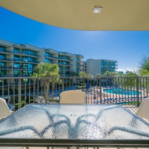 Bask in the coastal breeze, enjoying views of the vibrant pool area below