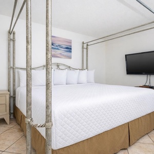 Unwind in the king master suite after a day at the beach and enjoy a good movie while you relax