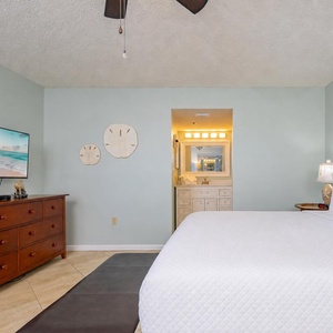 Relax on your plush king bed, enjoy the gentle breeze from the ceiling fan, and watch your favorite movie