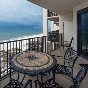 Enjoy meals or drinks on the balcony while taking in the views of the beach and tranquil waters