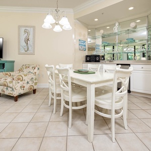 Gather around the dining table, sharing laughter and stories while enjoying the delightful coastal ambiance