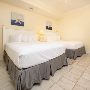 Relax on one of the cozy queen beds in this guest suite and enjoy a peaceful rest for the night