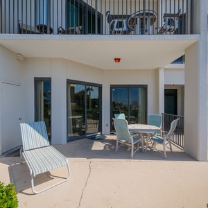 Enjoy a relaxing day in the sun on the outdoor patio with the pool and beach just steps away