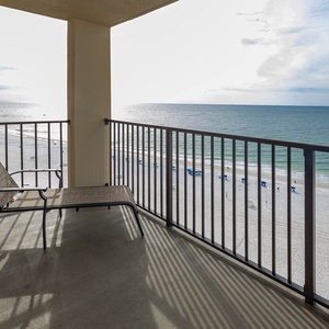Relax on the balcony overlooking the serene beach and tranquil waters, perfect for enjoying stunning sunsets