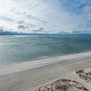 This bright space offers a stunning beachfront view, perfect for relaxation and enjoying the serene coastal atmosphere
