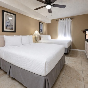 Two double beds in the guest suite invite restful nights after lively days by the shore breeze
