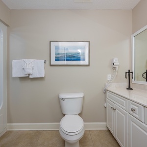 Refresh in this guest bath, featuring a refreshing shower and soft towels for your rejuvenating beach retreat