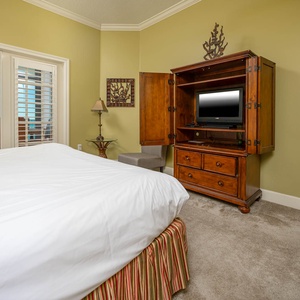 Relax after a fun beach day and enjoy a movie from the cozy king bed in the master suite