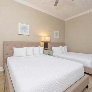 Experience restful nights in this queen guest suite, surrounded by serene decor for your family's getaway