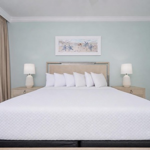 Retreat to the serene master bedroom with a king bed, soft linens, and calming decor, perfect for restful nights
