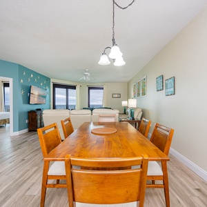 Relax at the dining table, savoring colorful decor and the inviting vibe while planning your beachside adventures