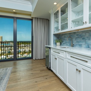 Savor refreshing drinks at your wet bar, while enjoying the serene vibe from the nearby views of the coast