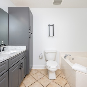 Refresh in the master bath after a day of adventure with a soothing jetted tub and relaxing walk-in shower