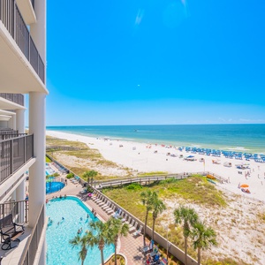 Experience spectacular views of the beach and pool area from your private balcony in this inviting coastal retreat