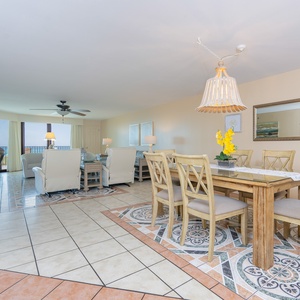Unwind in cozy seating, enjoying the scenic views and the beach vibe while bonding with family in the inviting living space