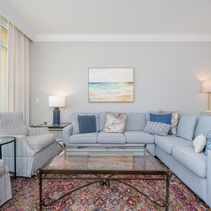 Relax on the cozy sofa with a queen sleeper in this inviting family room with breathtaking beachfront views