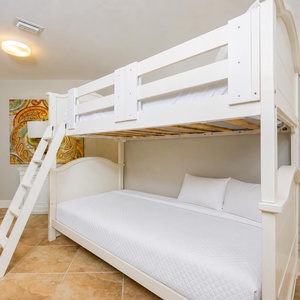 Discover a cozy bunk room designed for restful nights, where your family can share laughter and adventures after beach days
