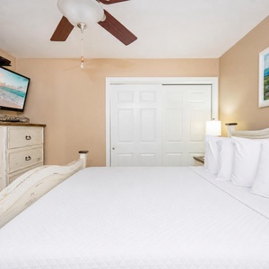 Rest your head on plush pillows in the king guest suite while streaming your favorite show on the wall TV