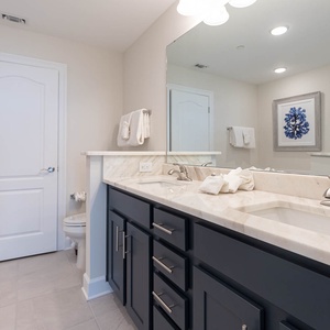 Refresh at the marbled double vanity, enjoy a refreshing shower, or soak in the tub in the master bath