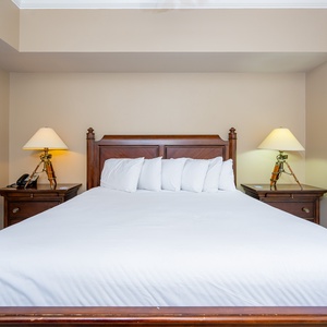 Unwind after a day at the beach in this elegant king master suite surrounded by stylish coastal accents