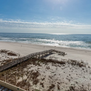 Enjoy the serene view from your balcony, overlooking the beach and gentle waves, perfect for relaxation