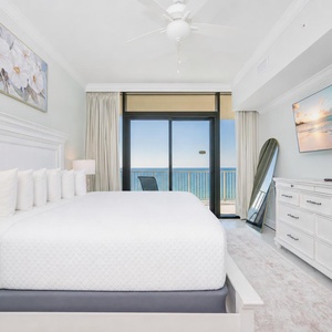 Enjoy restful nights in this inviting master bedroom with a king bed and beachfront balcony access