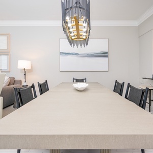 Dine comfortably at the spacious table, surrounded by elegant decor and inviting lighting for memorable gatherings