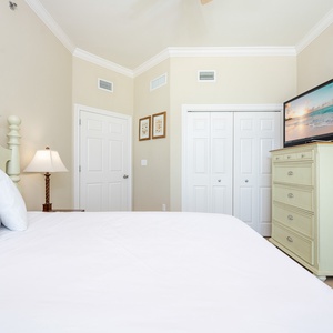 Drift into relaxation on the plush queen bed, enjoying the cozy vibe while watching your favorite shows in this guest suite